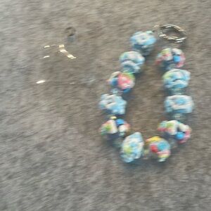 NEW Hand painted beads, cell phone wristlet. Pretty colors ideal for gift.